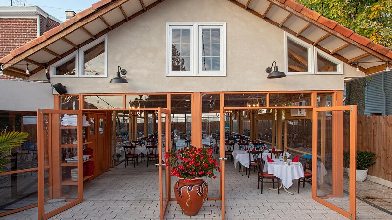 Covered patio seating area during the day